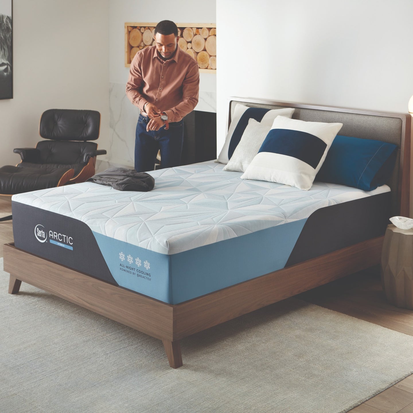 Man standing next to the Serta Arctic Mattress