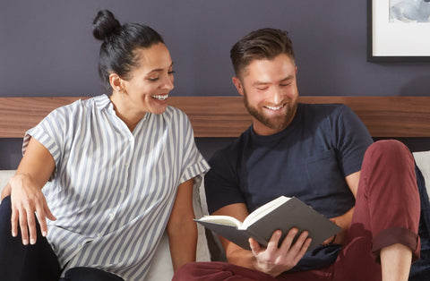 Couple reading in bed together