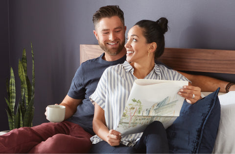 Couple looking at each other in bed